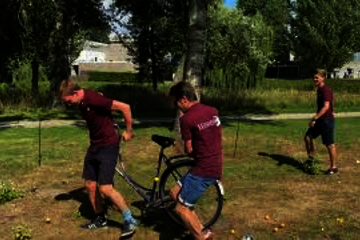 Biking with an imaginary frying pan (the box full of pingpong balls)