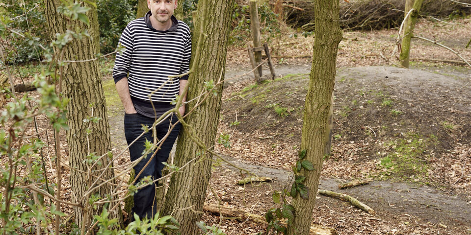 Krist Vaesen near a barrow in the prehistoric village Eindhoven. Photo | Bart van Overbeeke