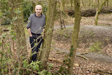 Krist Vaesen near a barrow in the prehistoric village Eindhoven. Photo | Bart van Overbeeke