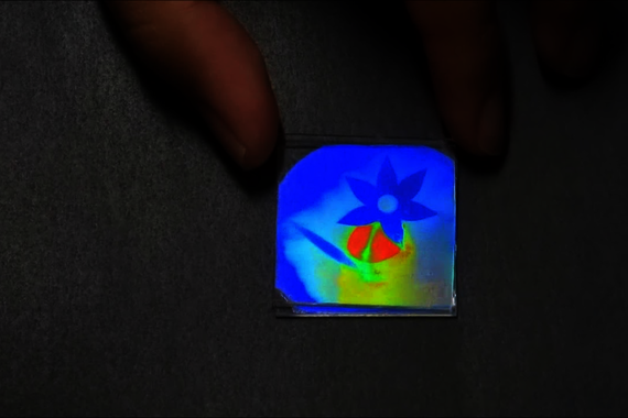 Movie by the group Stimuli-responsive Functional Materials and Devices (SFD): a drop of water reveals a brightly colored image.