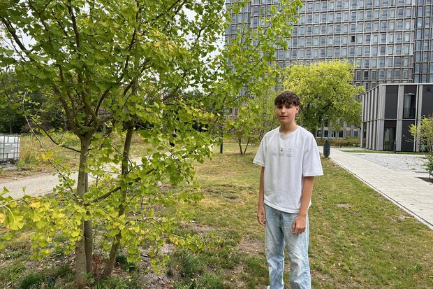 Student fascinated by medicinal plants growing on campus