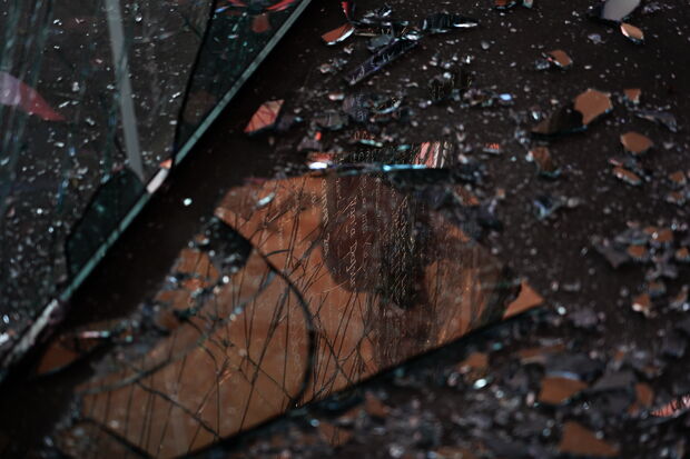 Broken window Alumni Avenue
