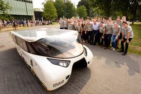 Proud students posing with their 'Lux'. Photo | Bart van Overbeeke