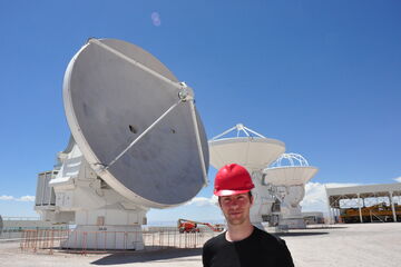 Rick with a mere three of the 66 antennas that make up the ALMA observatory.
