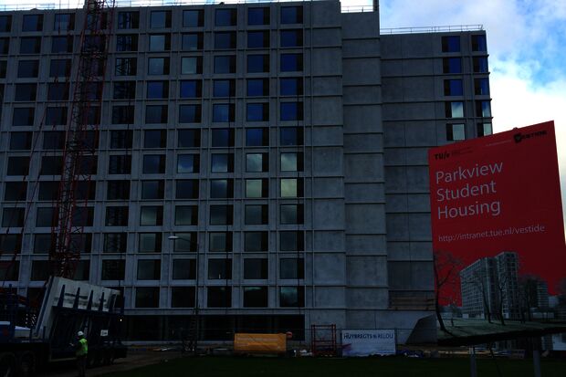 New-build residential tower block approaching top   