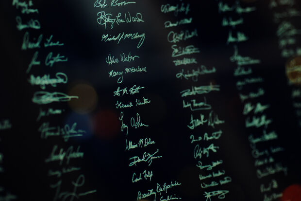 Signatures TU/e graduates etched in windows overpass