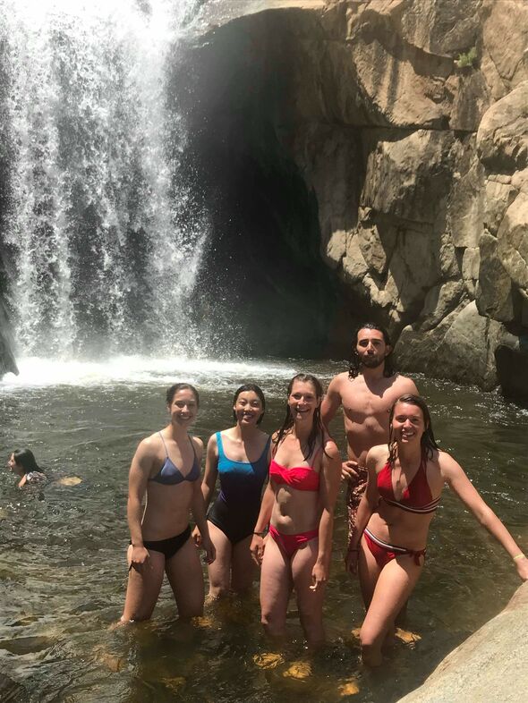 'Enjoying a refreshing swim underneath the waterfall after a challenging hike. (I’m the one in the middle, with the pink bikini).' Photo | private archive Judith Fonken