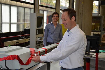 Tim Klaassen van Océ verklaart de printer voor geopend.